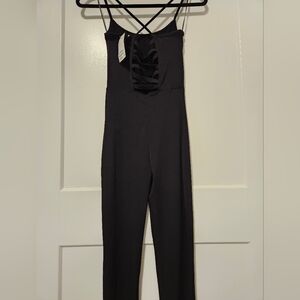NWT Express jumpsuit features a cut-out back.